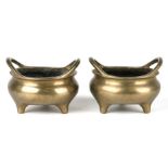 A pair of Chinese bronze censers of small proportion, six character marks to the bases, 9cms wide (