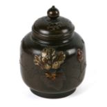 A Japanese Meiji period bronze and mixed metal shakudo miniature vase and cover, 6.5cms high.