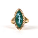 A yellow metal ( tests as high carat) hardstone cameo ring, the navette shaped cameo depicting a
