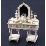A 19th century Prisoner of War bone miniature dressing table, 11.5cms high.Condition Report One