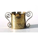 Trench art: A spill vase with scroll handles and engraved decoration, 8cms high. together with a