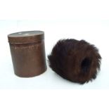 A late 19th / early 20th century fur muff in its original cardboard box, 18cms wide.