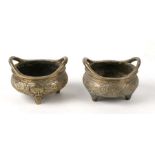 A pair of Chinese bronze censers, with dragons decoration, six character mark to base, each 9cms