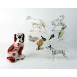 A Staffordshire pottery model of a spaniel, 24cms high; together with a Beswick Dalmatian; a
