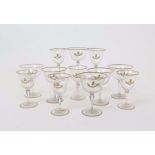 A part suite of armorial glass early 20th century, the generous bowls engraved and richly gilded