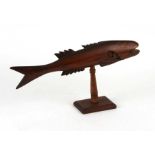 A carved wooden Pitcairn Island style fish, 37cms long.Condition Report Lacking fins.
