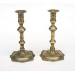 A pair of George III brass candlesticks with knopped stems, 18.5cms high (2).
