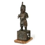 A large Benin Nigeria bronze figure of a chief, 53cms high.