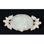 A Chinese jade pendant in the form of flowers and foliage,7cms long.Condition ReportGood condition
