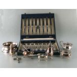 A cased set of silver plated dessert knives and forks, retailed by Garrard & Co; together with a