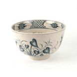 A Delft footed bowl decorated with dragonflies and foliage, 26cms diameter.