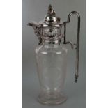 A 19th century silver plated and acid etched glass claret jug depicting hunting dogs, 32cms high.
