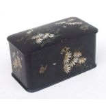 A Victorian black lacquer papier-mâché tea caddy decorated with flowers and butterflies, 22cms