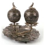 A 19th century silver coloured metal continental (possibly Spanish Colonial) double inkwell or spice