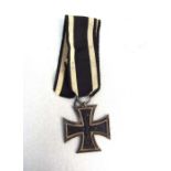 An original WW1 Imperial German Iron Cross 2nd Class with original ribbon. The ribbon suspension