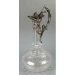 An Edwardian silver plated and glass claret jug with wheel engraved decoration, approx 29cms high.