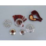 A group of Scottish sliver, white metal and pewter brooches and other items.