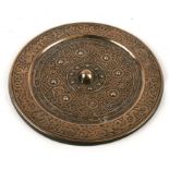 A Chinese polished bronze mirror with scroll decoration, four character mark to centre, 22cms