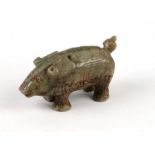 A Chinese celadon and russet jade pig, 7cms long.