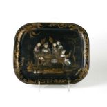 A 19th century chinoiserie Japanned tin tray decorated with figures around a table, 34 by 29cms.