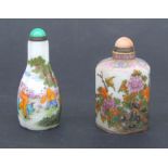 Two Chinese glass snuff bottles and stoppers decorated with birds, plants and children (2).