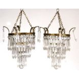 A pair of three-tier crystal drop chandeliers, 26cms diameter (2).