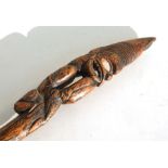 A late 19th / early 20th century Maori hardwood staff with figural top inlaid with mother of pearl