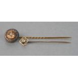 A 15ct gold and pearl stick pin; together with a 9ct gold stick pin (2).