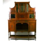 A late 19th century walnut sideboard, the superstructure with central glazed cupboard flanked by