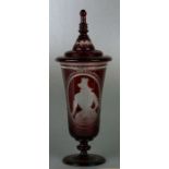 A Bohemian ruby flashed goblet and cover with engraved decoration depicting figures in an
