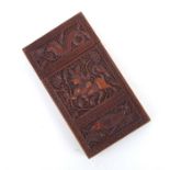 A 19th century Anglo Indian carved sandalwood visiting card case, finely relief carved with mythical