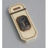 A Regency ivory yellow metal mounted love token snuff box of elongated octagonal form with blue