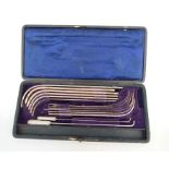 A late 19th / early 20th century cased white metal set of medical catheters, stamped Down, London