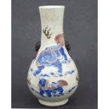 A Chinese crackleware two-handled baluster vase decorated with shi shi, 26cms high.Condition