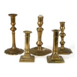 A group of five 18th century and later brass candlesticks, the largest 19cms high (5).
