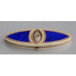 A Regency ivory yellow metal mounted and blue enamel toothpick box of navette form with central