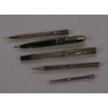 A silver fountain pen; together with three silver propelling pencils and another propelling