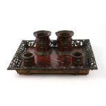 A 19th century bronze and rouge marble desk set, the rectangular tray with pierced gallery decorated
