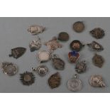 A quantity of silver fobs and medallions, various dates and makers, 145g.
