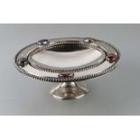 A silver plated tazza set with agate cabochons. 26cm diameter