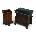 An oak box stool with upholstered seat and carved lion mask handles, 45cms wide; together with an
