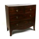 A Regency mahogany bowfronted chest of two short and two graduated long drawers, on splay bracket