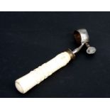 A 19th century ham bone / lamp shank holder with steel thumb screw and carved bone handle, 17cms