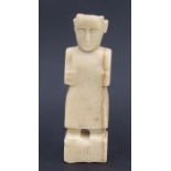 A Middle Eastern / Persian carved stone figure with script to face, 42cms high.