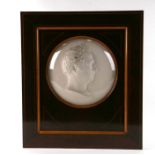 A large circular plaster cameo portrait panel, possibly Louis Philippe, signed 'AF Thomas' and