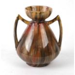 A Christopher Dresser style pottery two-handled vase, 19cms high.Condition ReportGlued repair to the