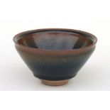A Chinese Jian ware style hare's fur bowl with incised mark to the underside, 13cms diameter.