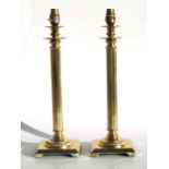 A pair of modern brass column table lamps, 40cms high.