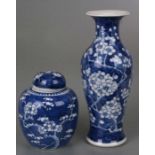 A Chinese blue & white baluster vase decorated with prunus, four character blue mark to the