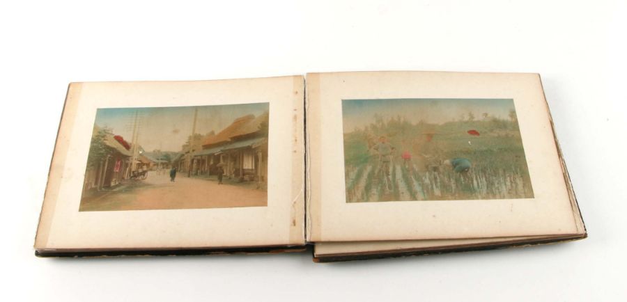An early 20th century Japanese lacquer concertina photograph album containing twenty two travel